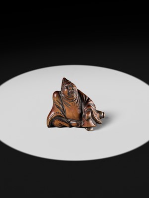 A WOOD NETSUKE OF A TEMPLE SERVANT (EJI)
