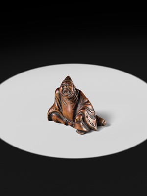 A WOOD NETSUKE OF A TEMPLE SERVANT (EJI)