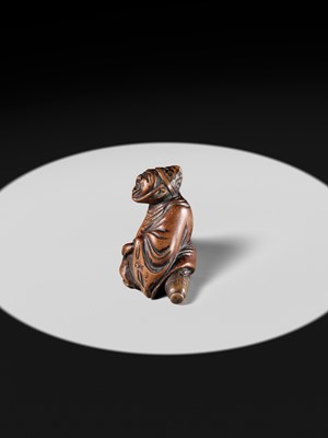 A WOOD NETSUKE OF A TEMPLE SERVANT (EJI)