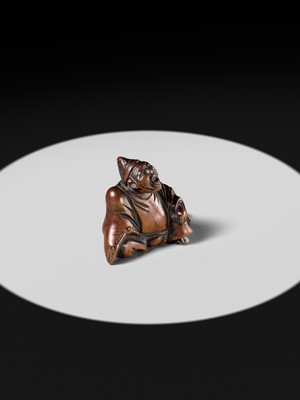 A WOOD NETSUKE OF A TEMPLE SERVANT (EJI)