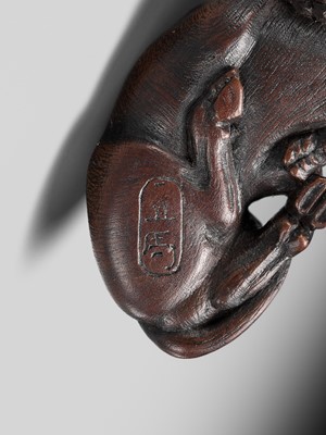 Lot 191 - ITTAN: A FINE WOOD NETSUKE OF A RECUMBENT OX