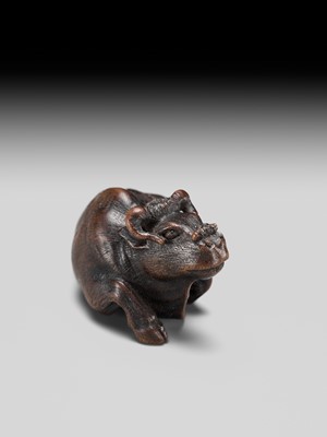 Lot 191 - ITTAN: A FINE WOOD NETSUKE OF A RECUMBENT OX