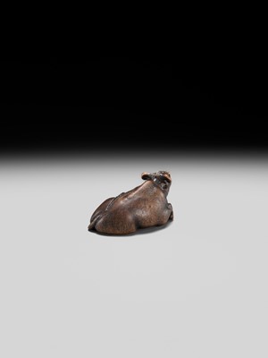 Lot 191 - ITTAN: A FINE WOOD NETSUKE OF A RECUMBENT OX