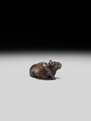 Lot 191 - ITTAN: A FINE WOOD NETSUKE OF A RECUMBENT OX