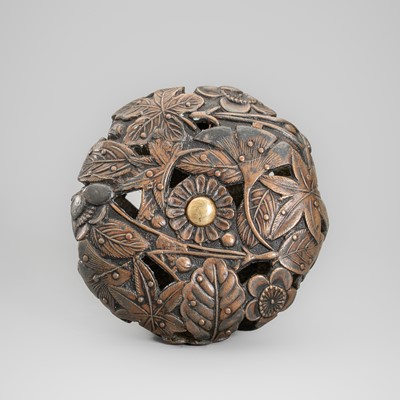 A FINE COPPER ALLOY RYUSA MANJU NETSUKE WITH LEAVES