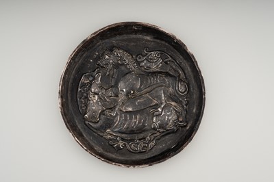 Lot 1000 - AN ACHAEMENID SILVER REPOUSSÉ PLATE WITH ANIMALS