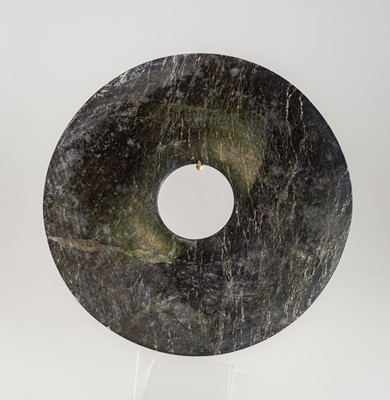 Lot 785 - A DARK GREEN SERPENTINE DISC, BI, MING DYNASTY