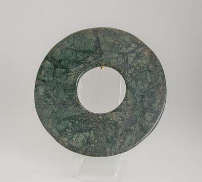 Lot 1820 - A SERPENTINE DISC, BI, QING DYNASTY OR EARLIER