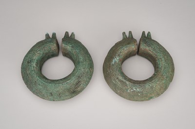 Lot 1092 - A HEAVY PAIR OF BRONZE BANGLES, DONG SON CULTURE