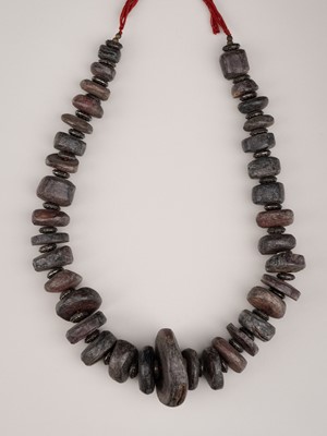 Lot 685 - A HIMALAYAN NECKLACE WITH THIRTY-FIVE AMBER BEADS, 16TH – 17TH CENTURY