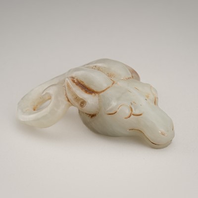 Lot 1857 - A PALE CELADON JADE ‘RAM HEAD’ CARVING, REPUBLIC PERIOD