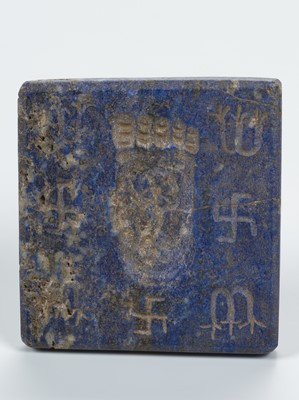 Lot 2185 - A WESTERN ASIATIC LAPIS LAZULI INTAGLIO PLAQUE WITH BUDDHA’S FOOTPRINT, 5TH–7TH CENTURY