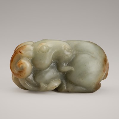 Lot 1810 - A PALE CELADON HARDSTONE CARVING OF A RECUMBENT RAM