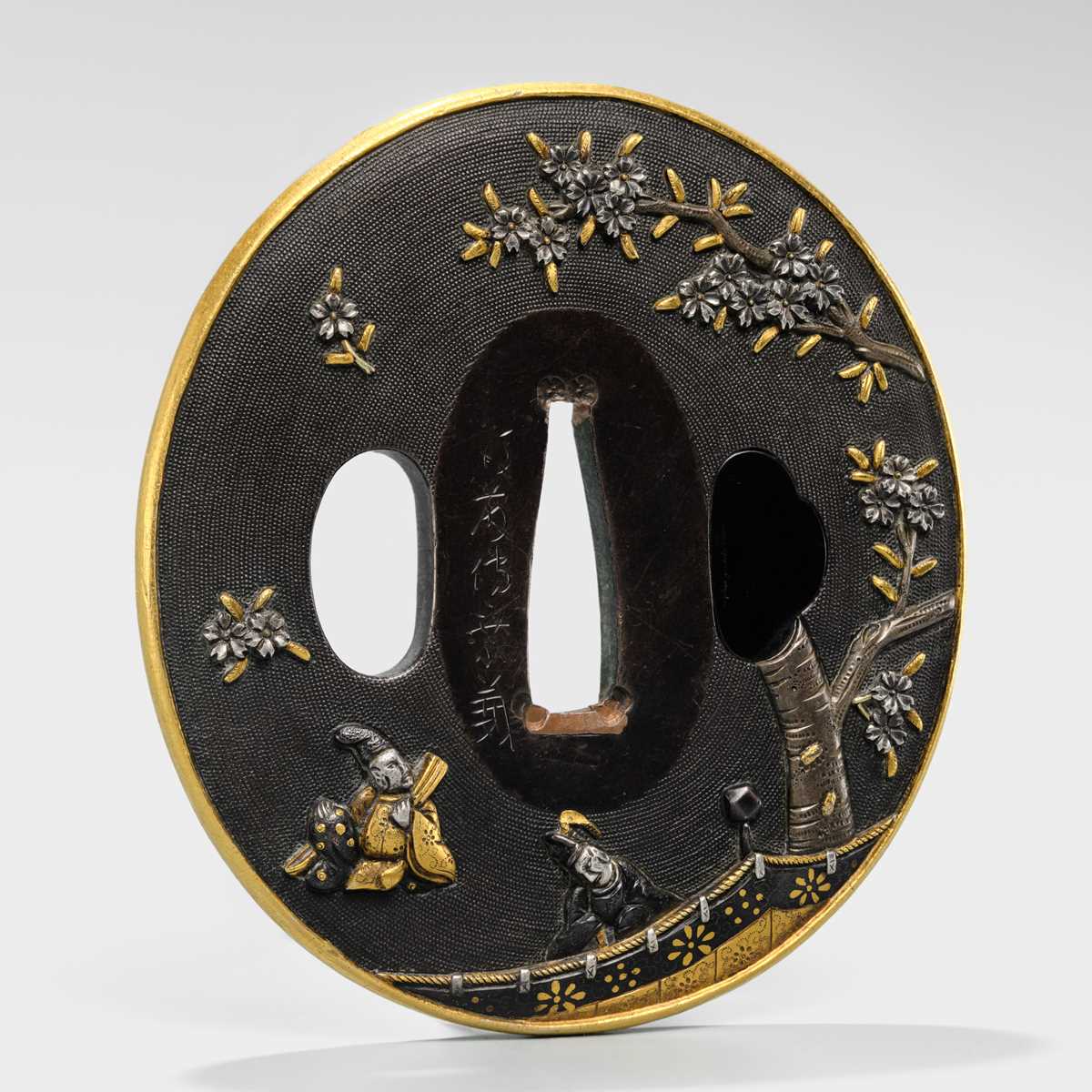 Lot 82 - GOTO DENJO: A FINE SHAKUDO NANAKO TSUBA WITH A SCENE FROM TALE OF GENJI