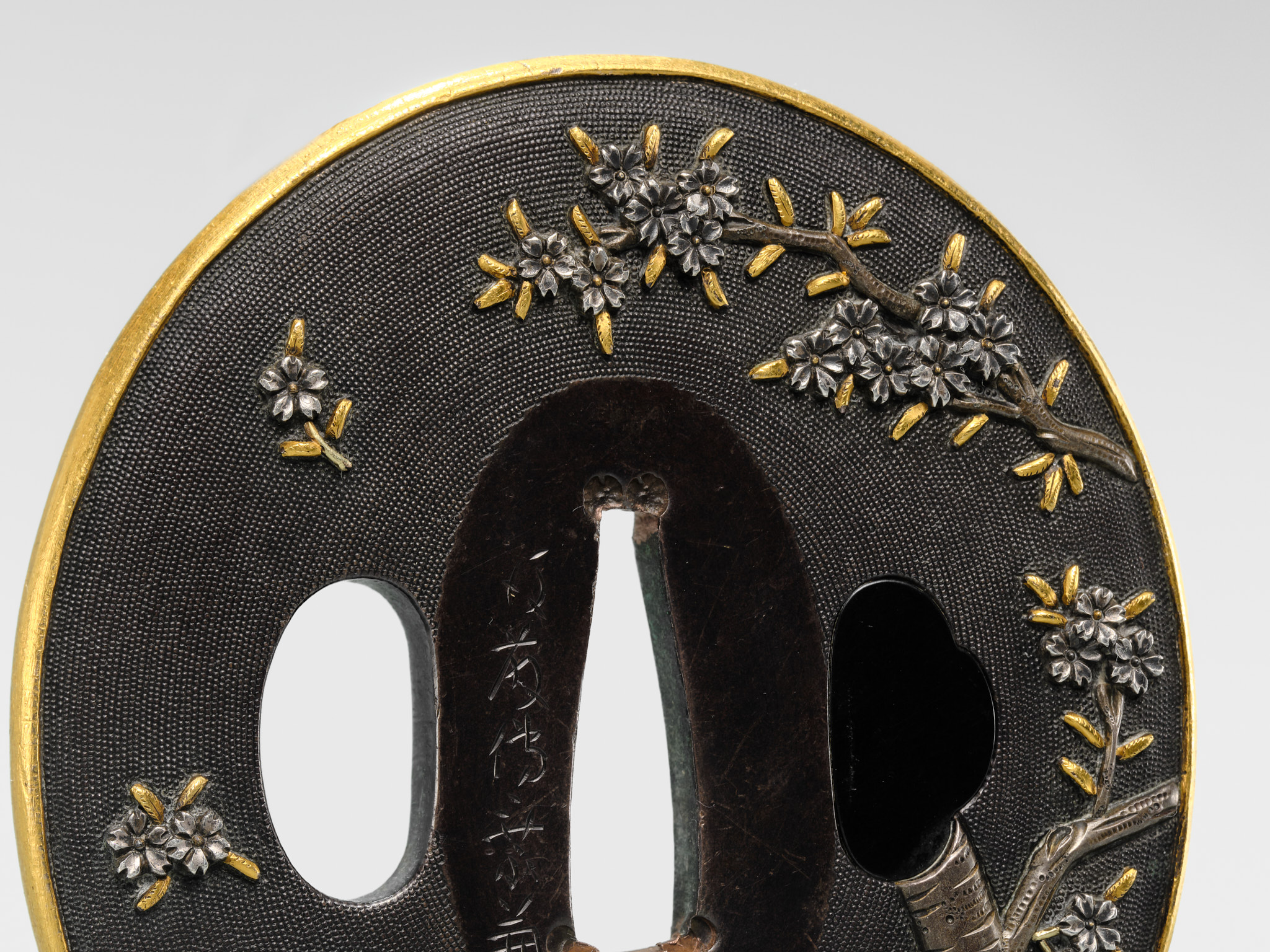 Lot 82 - GOTO DENJO: A FINE SHAKUDO NANAKO TSUBA WITH