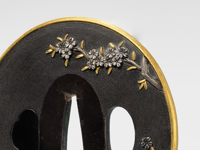 Lot 82 - GOTO DENJO: A FINE SHAKUDO NANAKO TSUBA WITH A SCENE FROM TALE OF GENJI