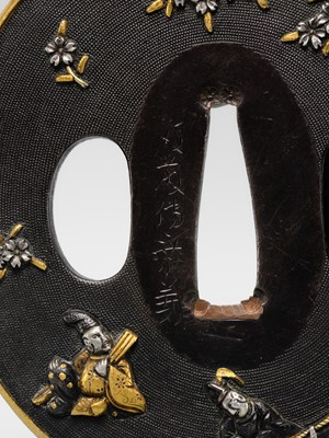 Lot 82 - GOTO DENJO: A FINE SHAKUDO NANAKO TSUBA WITH A SCENE FROM TALE OF GENJI