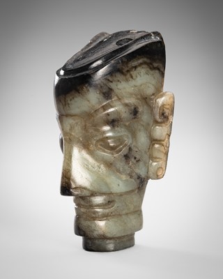 Lot 969 - AN ARCHAISTIC PALE CELADON AND BROWN JADE SANXINGDUI HEAD, LATE QING DYNASTY TO REPUBLIC PERIOD