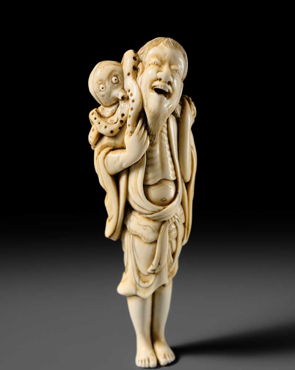 Lot 110 - A RARE TALL IVORY NETSUKE OF AN IMMORTAL WITH AN OCTOPUS