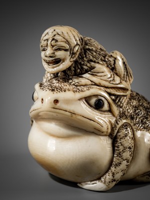 Lot 362 - AN OSAKA SCHOOL IVORY NETSUKE OF GAMA SENNIN ON A HUGE TOAD