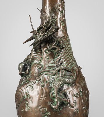 Lot 7 - AKASOFU GYOKKO: A BRONZE ‘DRAGON’ VASE WITH SMALL CRYSTAL SPHERE