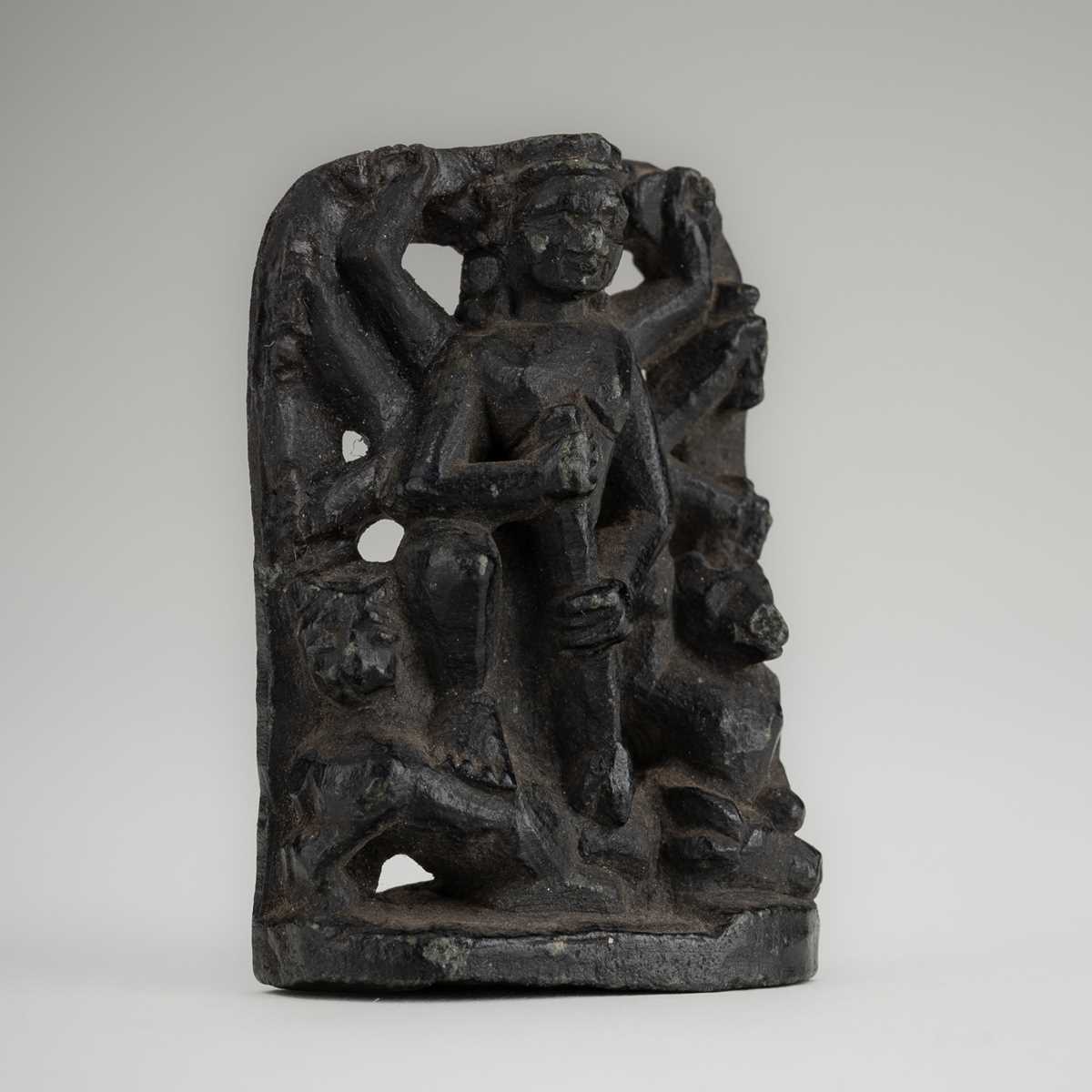 A SMALL STONE STELE OF DURGA SLAYING THE BUFFALO-DEMON MAHISHA, c. 16TH CENTURY