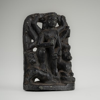 Lot 984 - A SMALL STONE STELE OF DURGA SLAYING THE BUFFALO-DEMON MAHISHA, c. 16TH CENTURY