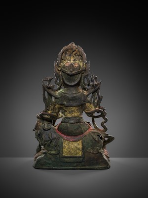 Lot 58 - A PAINTED BRONZE FIGURE OF MANJUSHRI ON A LION, MING DYNASTY