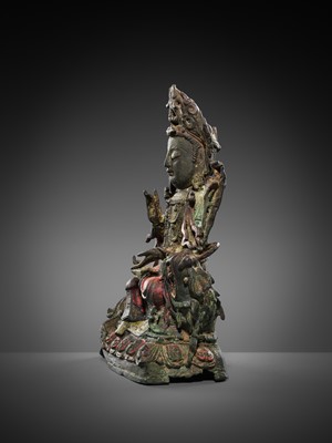 Lot 58 - A PAINTED BRONZE FIGURE OF MANJUSHRI ON A LION, MING DYNASTY
