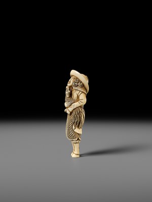 AN IVORY NETSUKE OF A DUTCHMAN WITH COCKEREL