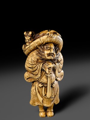 Lot 126 - A POWERFUL KYOTO SCHOOL IVORY NETSUKE OF SHOKI AND ONI