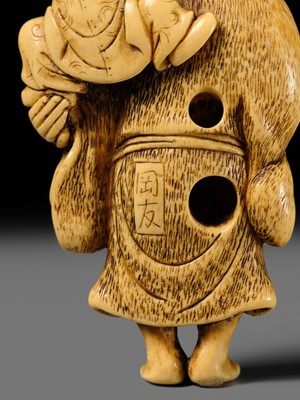 Lot 124 - OKATOMO: A FINE IVORY NETSUKE OF HOTEI WITH A KARAKO
