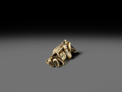 Lot 131 - NIRAKU: AN OSAKA SCHOOL IVORY NETSUKE OF A DUTCHMAN WITH A TRUMPET