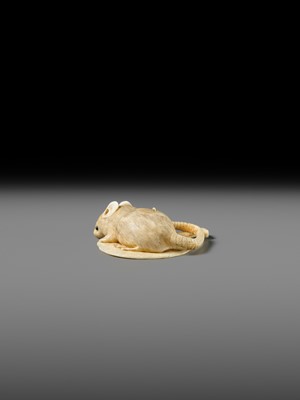 Lot 438 - MASATAMI: A FINE IVORY NETSUKE OF A RAT ON A FAN