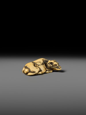 A GOOD KYOTO SCHOOL IVORY NETSUKE OF A RECUMBENT OX