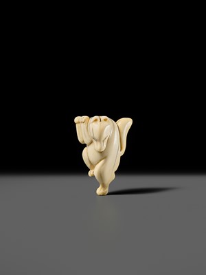 Lot 429 - AN IVORY NETSUKE OF A DANCING KITSUNE