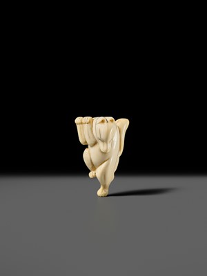 Lot 429 - AN IVORY NETSUKE OF A DANCING KITSUNE
