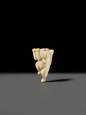 Lot 429 - AN IVORY NETSUKE OF A DANCING KITSUNE