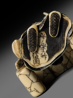 Lot 166 - ANRAKUSAI NOBUKUNI: A SUPERB INLAID IVORY NETSUKE OF SEIOBO