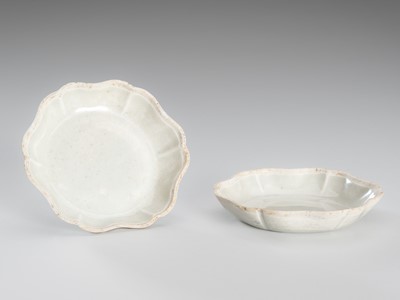 Lot 1081 - A PAIR OF SMALL BLOSSOM-SHAPED QINGBAI PORCELAIN DISHES, SONG DYNASTY