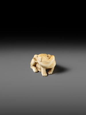 Lot 137 - A KYOTO SCHOOL IVORY NETSUKE OF AN EMACIATED WOLF