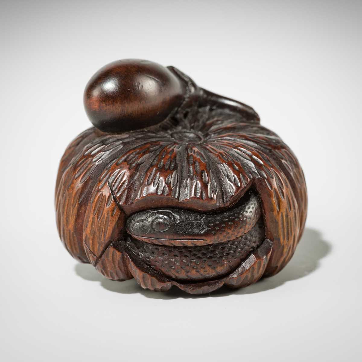 Lot 377 - SHIGEMASA: A FINE WOOD NETSUKE OF A PUMPKIN WITH A SNAKE AND NASUBI (EGGPLANT)