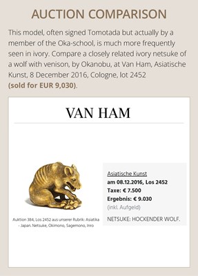 Lot 146 - A FINE WOOD NETSUKE OF A WOLF WITH HAUNCH OF VENISON, ATTRIBUTED TO OKATOMO
