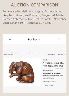 Lot 146 - A FINE WOOD NETSUKE OF A WOLF WITH HAUNCH OF VENISON, ATTRIBUTED TO OKATOMO