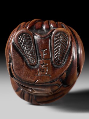 Lot 120 - A SUPERB WOOD NETSUKE OF FUKUROKUJU WITH A KARAKO, ATTRIBUTED TO TSUJI