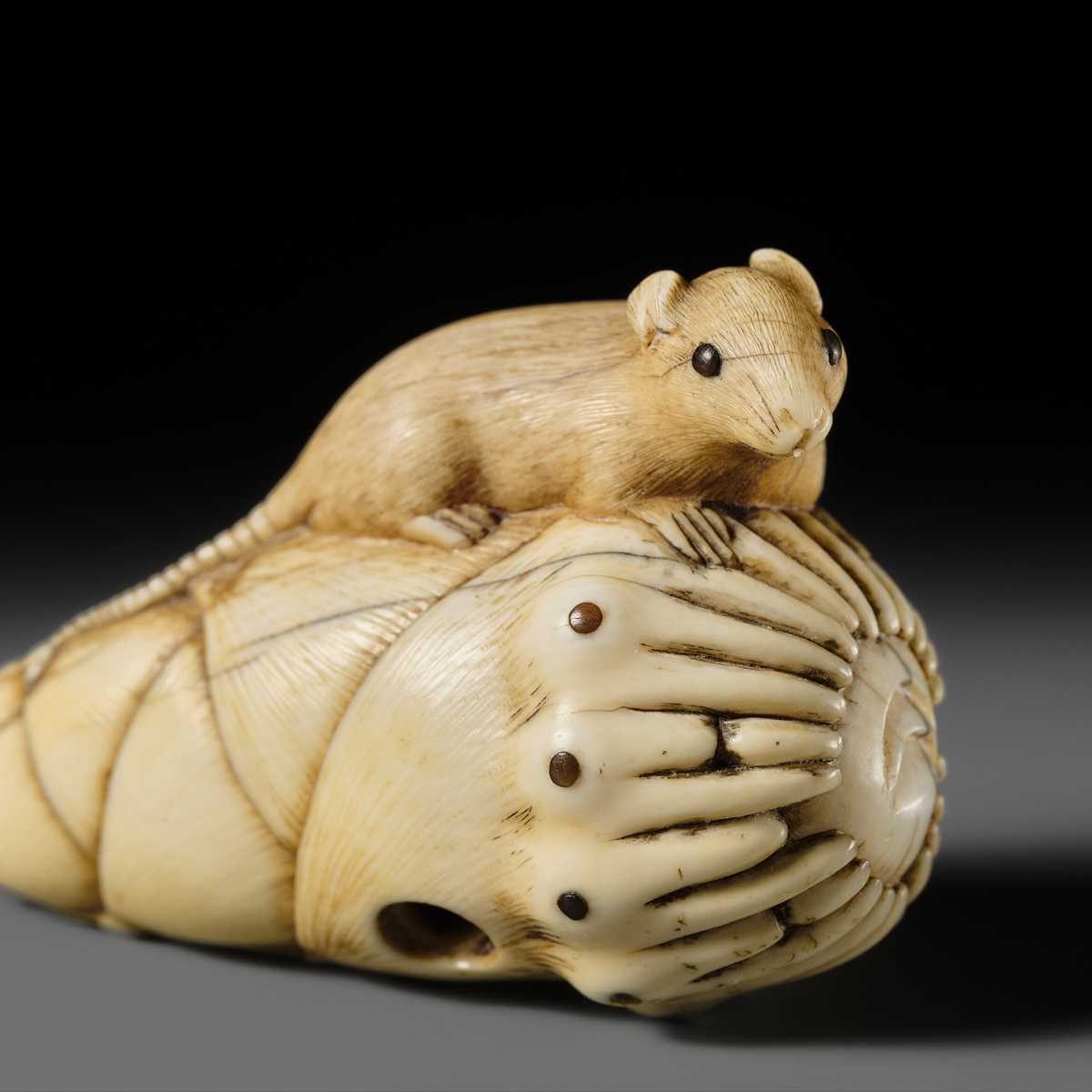 Lot 138 - A CHARMING KYOTO SCHOOL IVORY NETSUKE OF A RAT ON A BAMBOO SHOOT