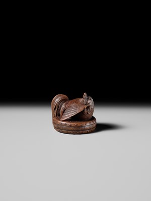 Lot 187 - MASATAMI: A WOOD NETSUKE OF A COCKEREL ON A WAR DRUM