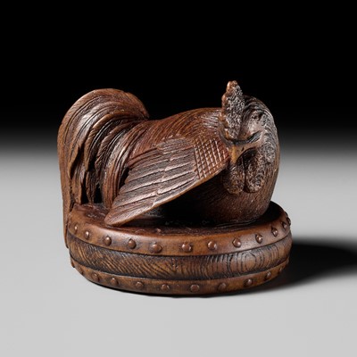 Lot 187 - MASATAMI: A WOOD NETSUKE OF A COCKEREL ON A WAR DRUM
