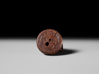 Lot 187 - MASATAMI: A WOOD NETSUKE OF A COCKEREL ON A WAR DRUM
