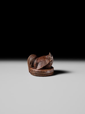 Lot 187 - MASATAMI: A WOOD NETSUKE OF A COCKEREL ON A WAR DRUM